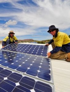 Power and Water employees installing solar PV systems