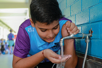 Anula School students in a classroom learning on how to save water.