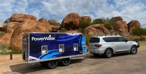 Water trailer parked in front of Devil's Marbles near Tennant Creek